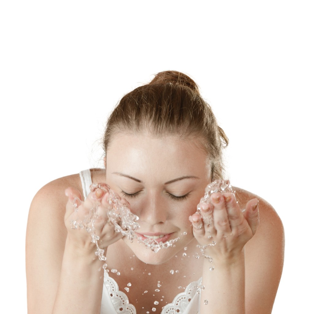 young girl washes with clean water