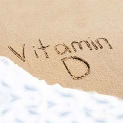 Vitamin D written in sand