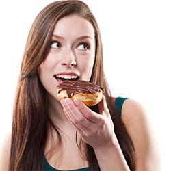 Woman eating donut