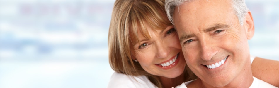 banner image of a happy old couple smiling at the camera