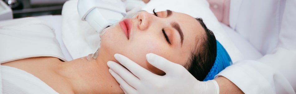 woman laying down prepped for IPL treatment