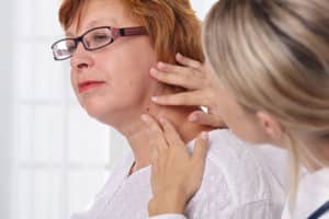 Doctor dermatologist examines skin tags