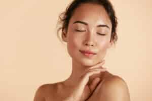 Woman with beautiful glowing skin after laser rejuvenation treatment