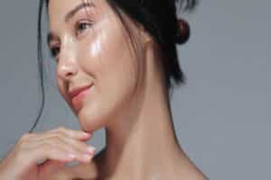 Woman with smooth, glowing skin after regular facials in Los Angeles, CA