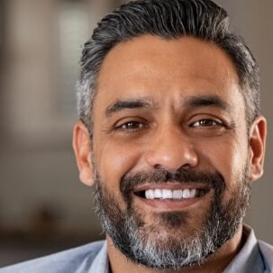 man smiling after getting botox